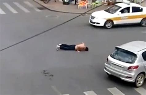 man falls out of car